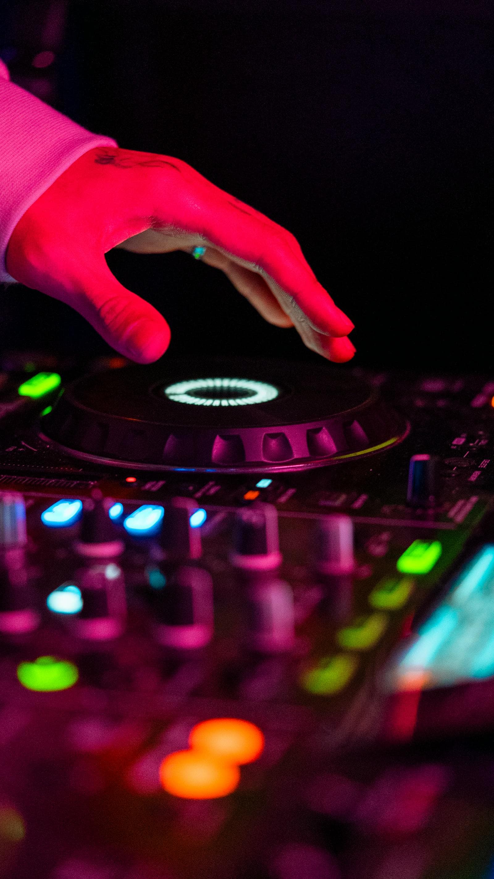 DJ on the mic MCing a destination wedding in Spain for English-speaking guests
